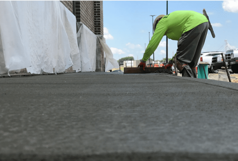 man performing concrete work